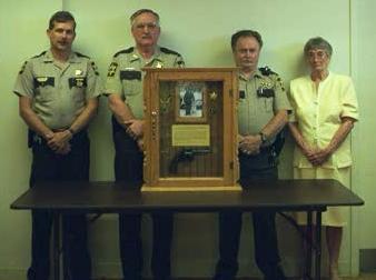 Sheriff Paul Sanders presenting memorial to Livengood's mother in 1998